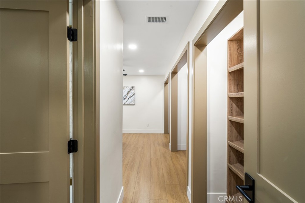 3660 Pioneer Boulevard Long Beach, CA 90808 - Photo 38 of 50 a view of a hallway with wooden floor and staircase