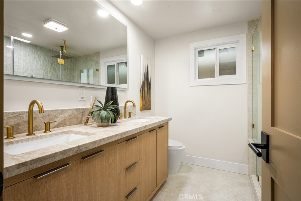 3660 Pioneer Boulevard Long Beach, CA 90808 - Photo 43 of 50 a bathroom with a sink and a mirror
