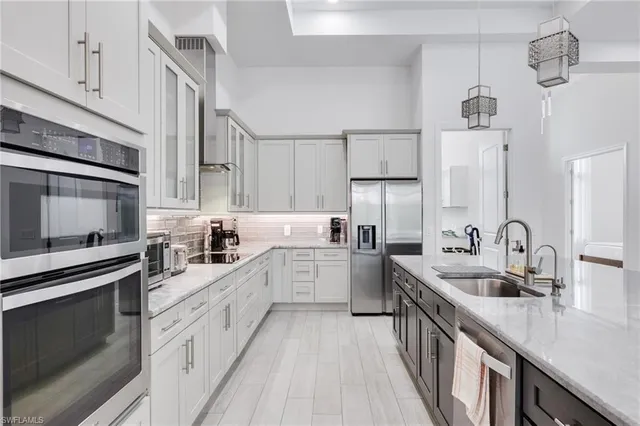 a kitchen with cabinets a sink and appliances