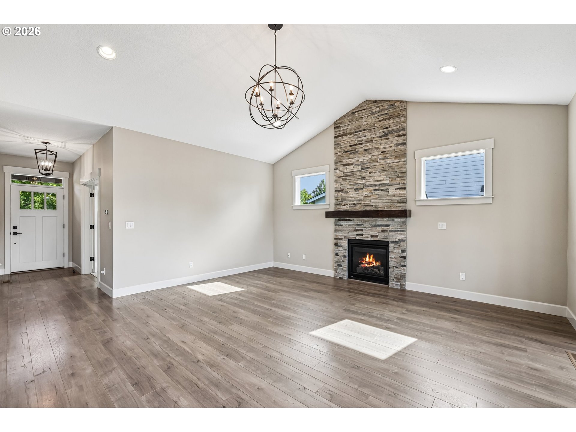 38320 Sequoia Street Sandy, OR 97055 - Photo 5 of 33 a view of an empty room with wooden floor fireplace and a window
