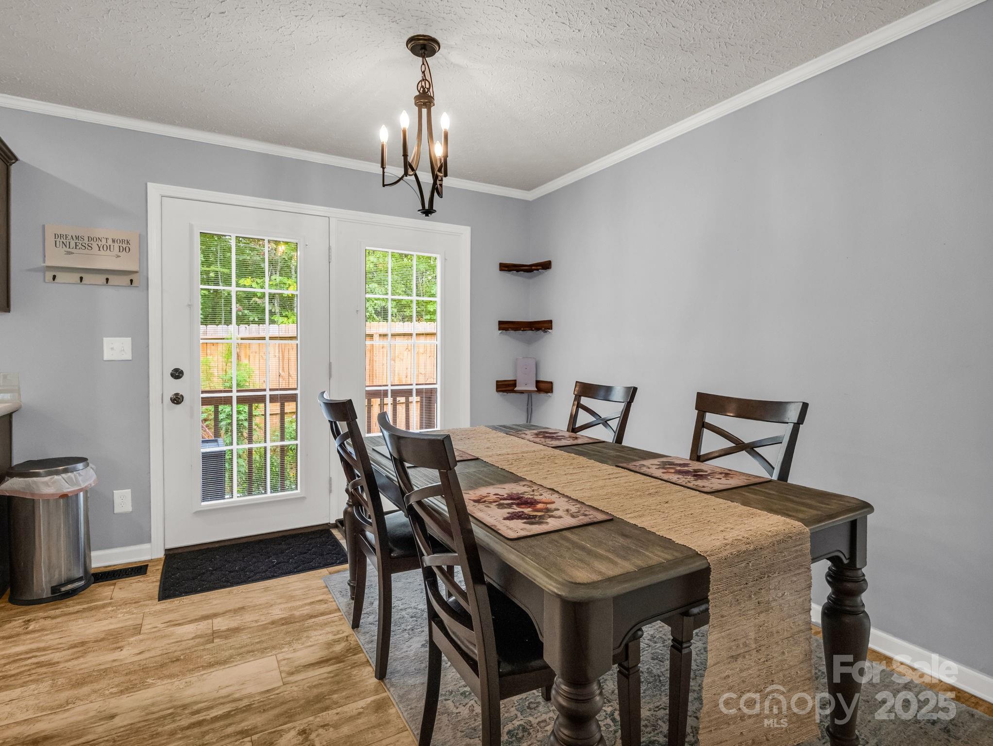 343 East Marshall Ridge Road Hendersonville, NC 28792 - Photo 12 of 44 a view of a dining room with furniture window and outside view