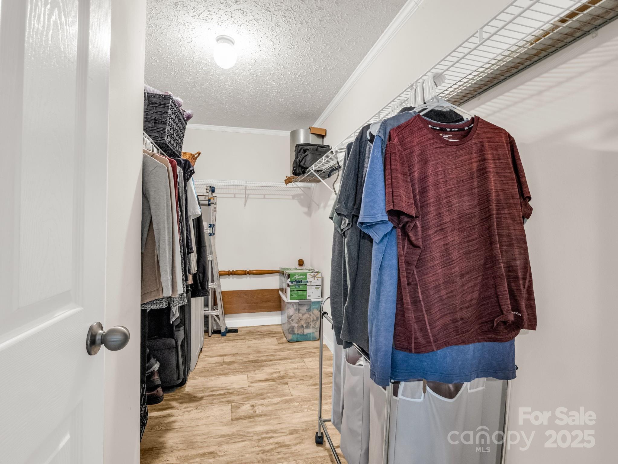 343 East Marshall Ridge Road Hendersonville, NC 28792 - Photo 17 of 44 a view of walk in closet with clothes and shoes
