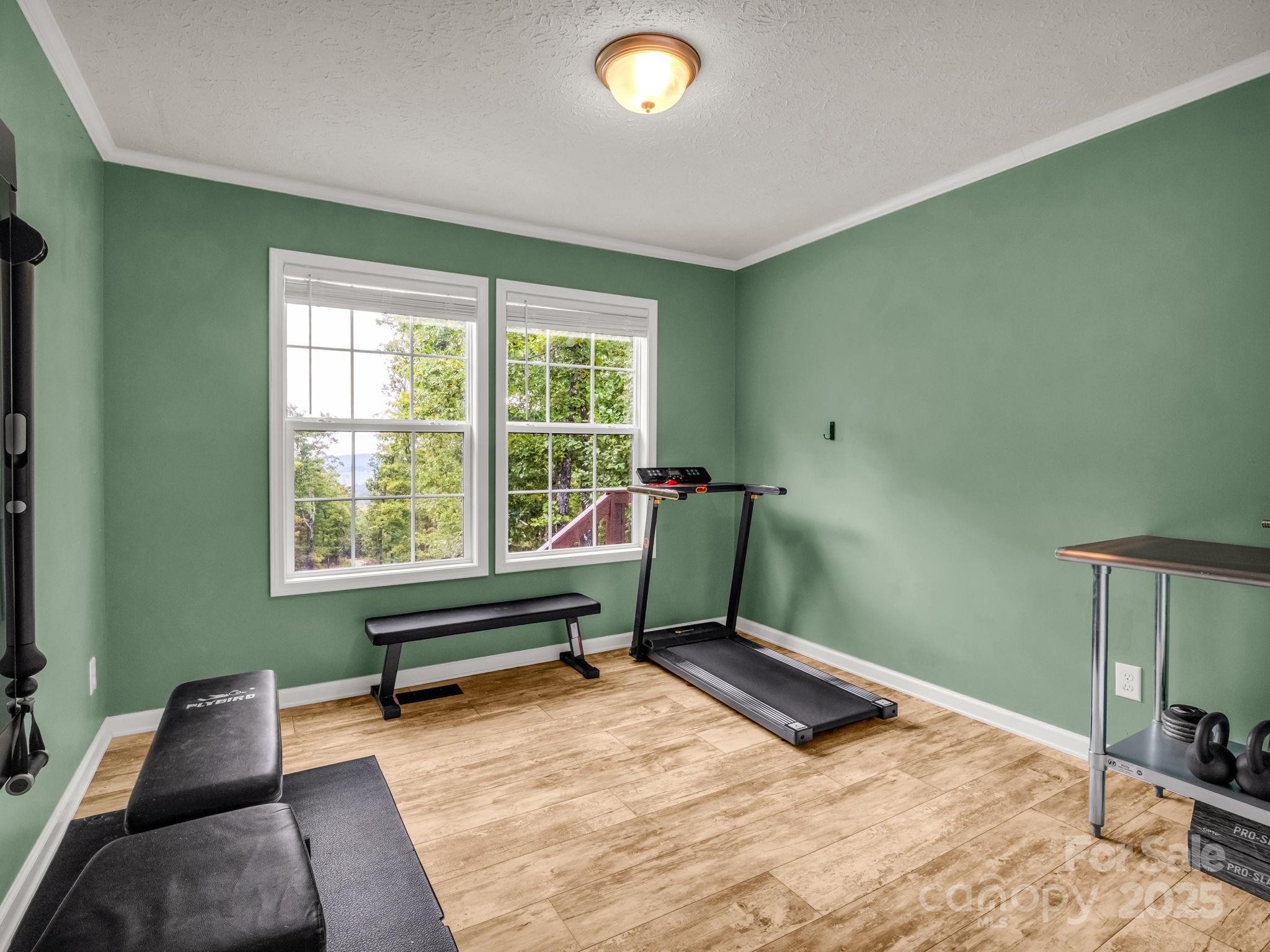 343 East Marshall Ridge Road Hendersonville, NC 28792 - Photo 18 of 44 a bedroom with a bed and a window