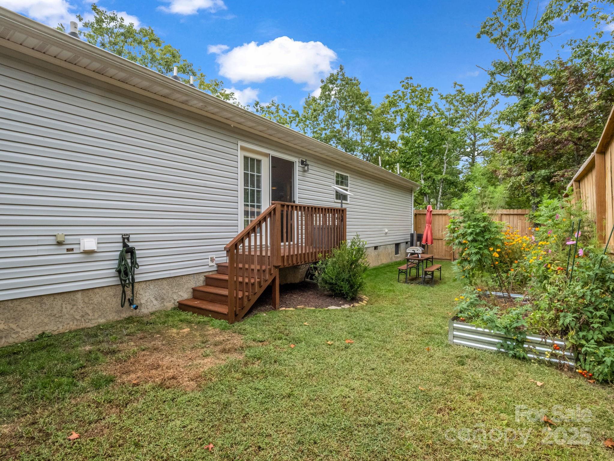 343 East Marshall Ridge Road Hendersonville, NC 28792 - Photo 33 of 44 a front view of a house with garden
