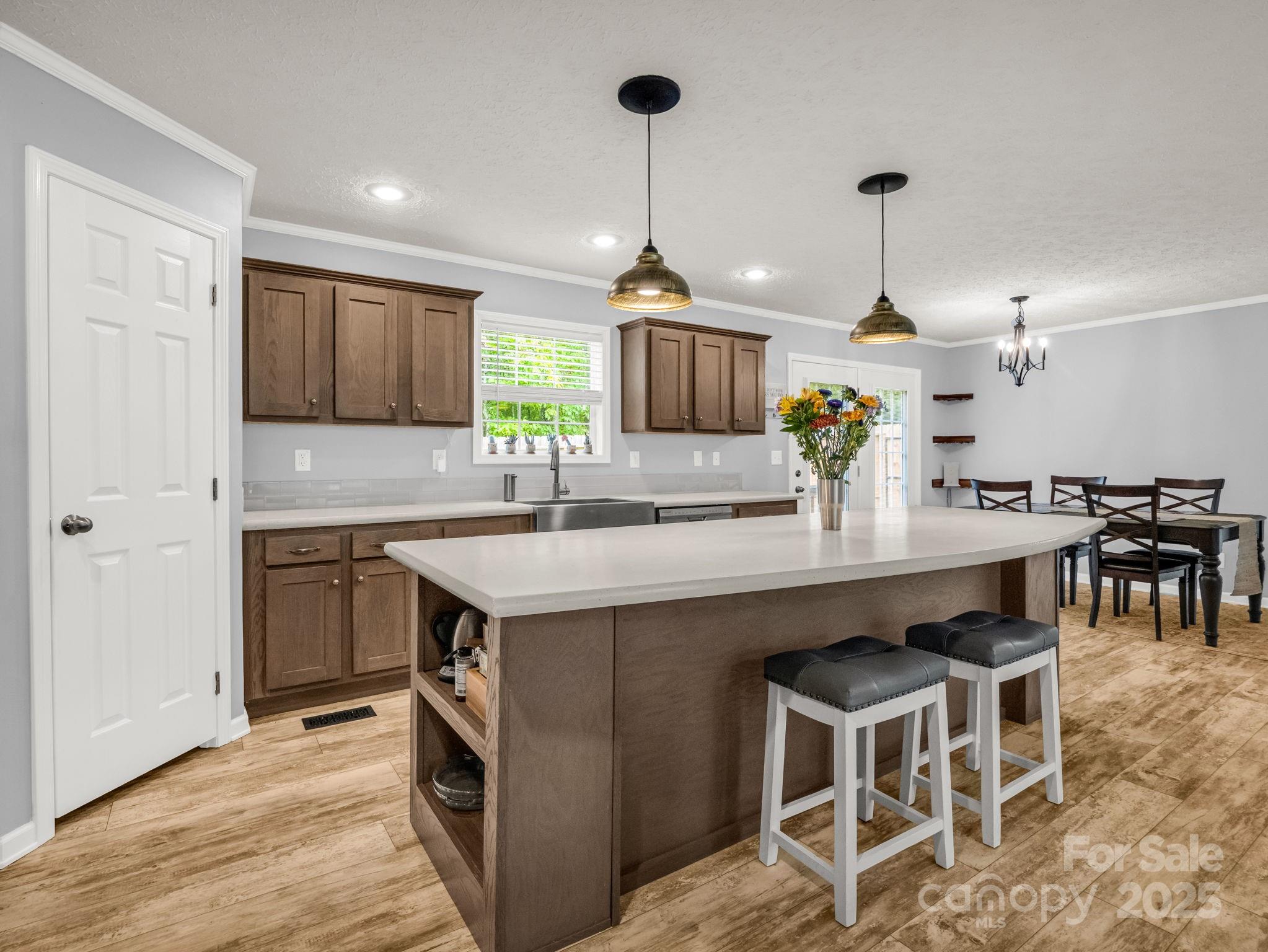 343 East Marshall Ridge Road Hendersonville, NC 28792 - Photo 7 of 44 a kitchen with granite countertop a sink a counter space appliances and cabinets