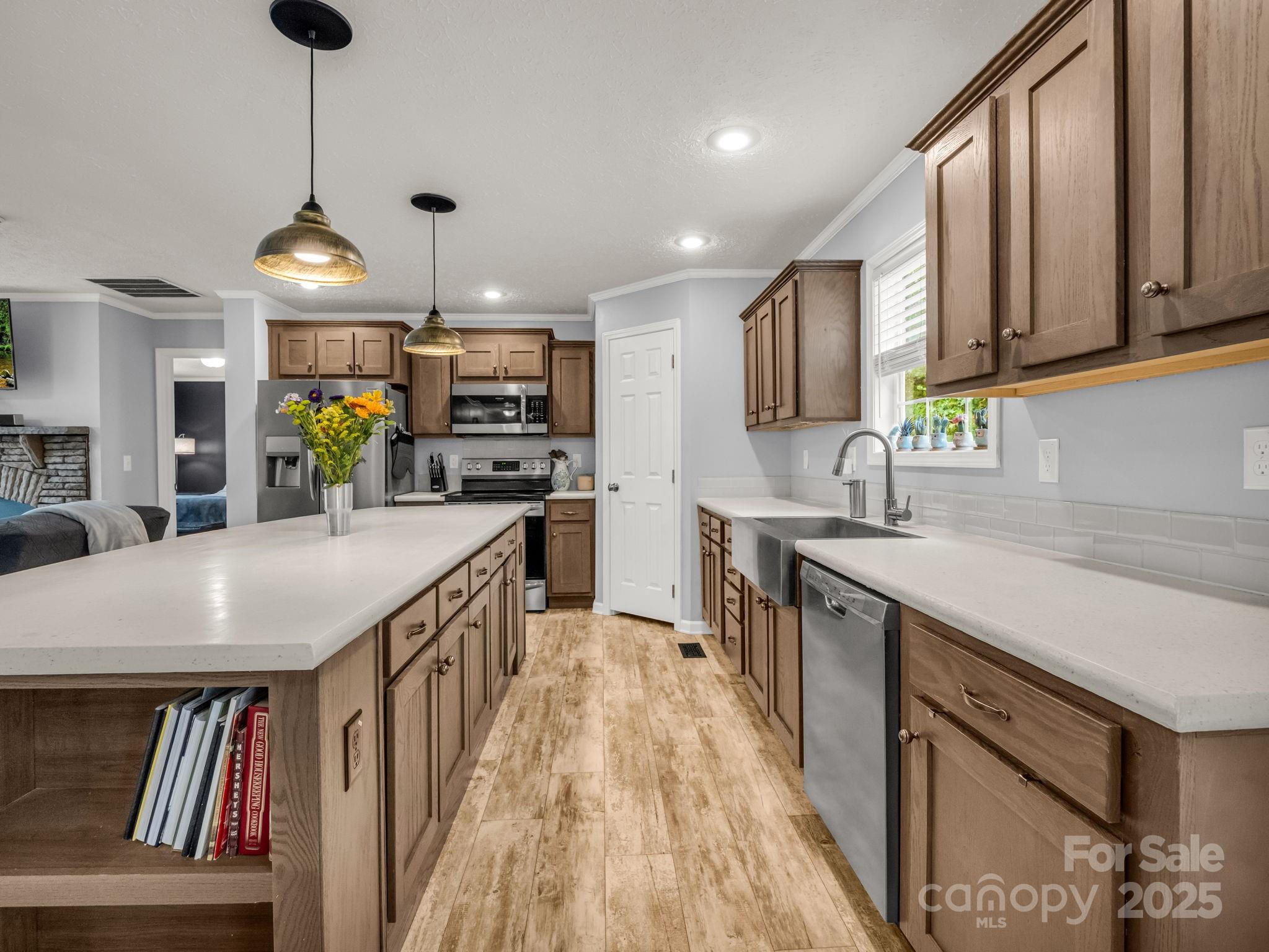 343 East Marshall Ridge Road Hendersonville, NC 28792 - Photo 9 of 44 a kitchen with stainless steel appliances granite countertop a sink and cabinets