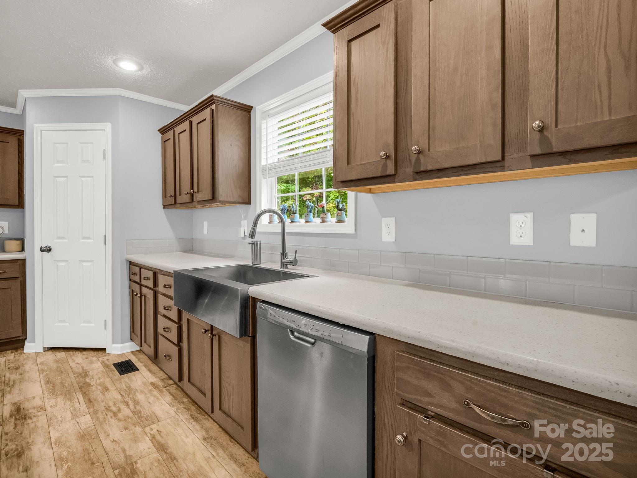 343 East Marshall Ridge Road Hendersonville, NC 28792 - Photo 10 of 44 a kitchen with stainless steel appliances granite countertop a sink a stove and a microwave
