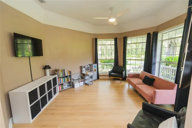 a view of a livingroom with furniture and windows