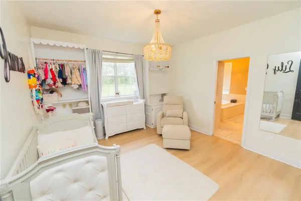 a spacious bathroom with a double vanity sink a mirror and a shower
