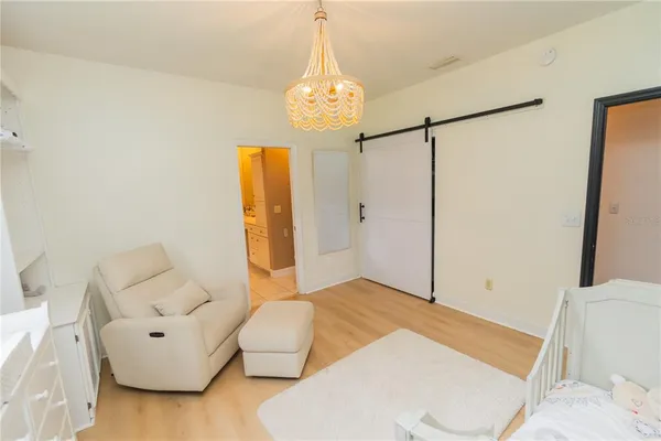 a spacious bedroom with a bed and a fireplace