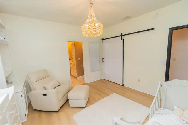 a spacious bedroom with a bed and a fireplace