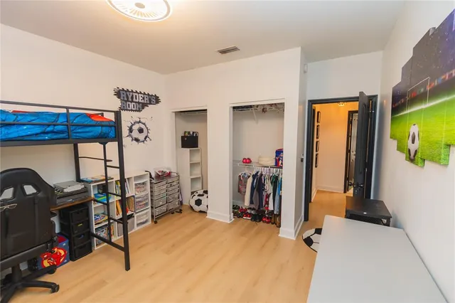 a bedroom with a bed and a fireplace