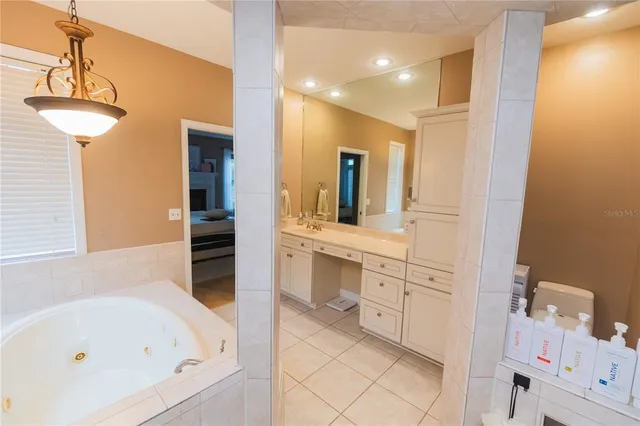 a dining room with furniture window and wooden floor