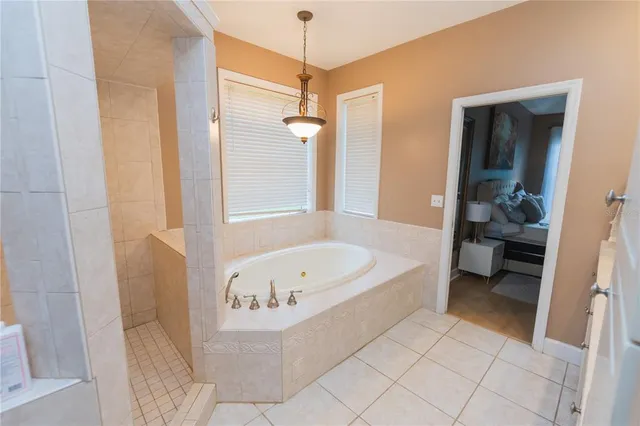 a kitchen with a stove a faucet and a refrigerator