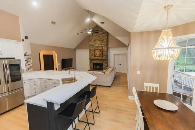 a view of a house with a yard deck and a garden