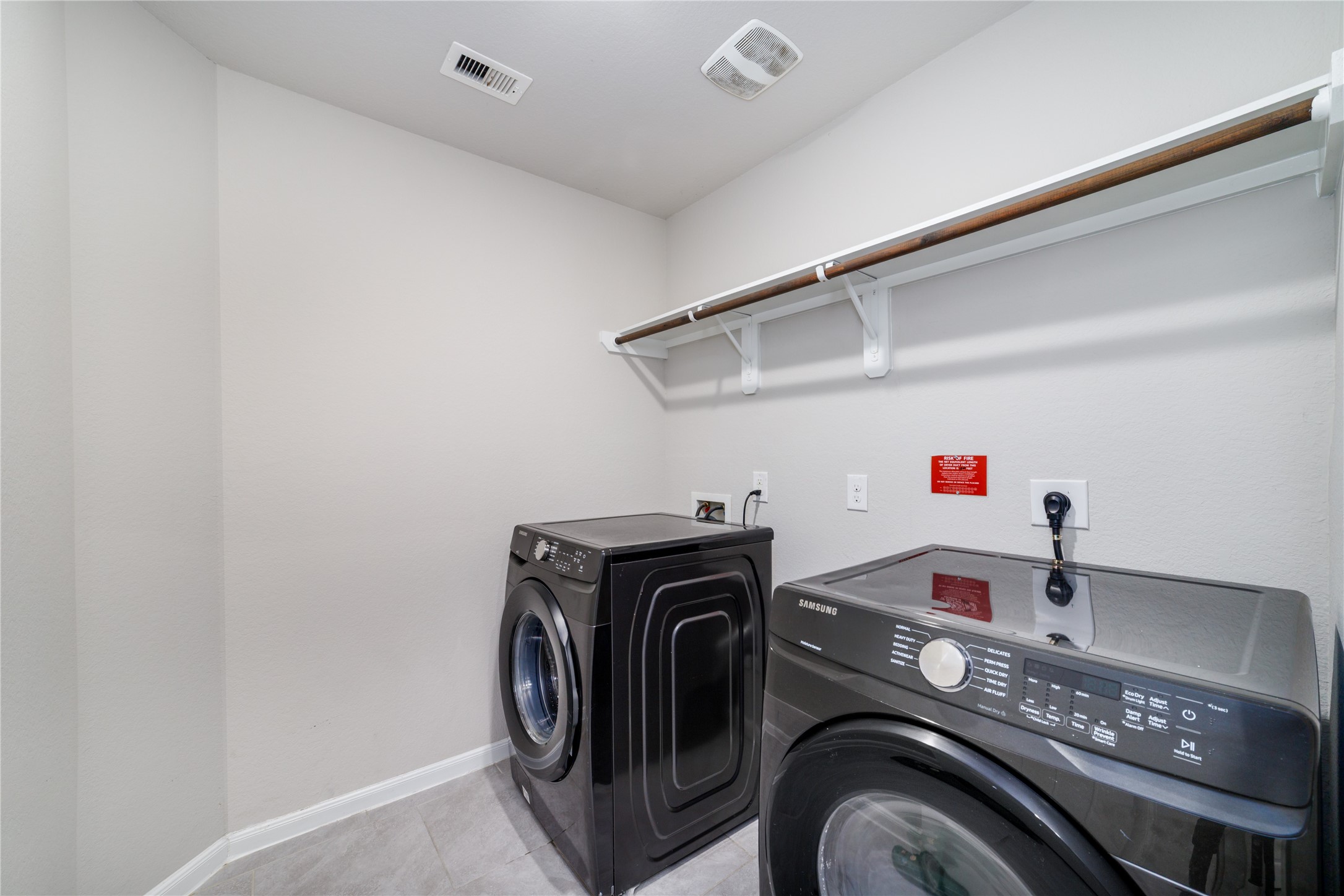 8307 Oakleaf Meadow Court Rosharon, TX 77583 - Photo 30 of 39 a utility room with dryer and washer