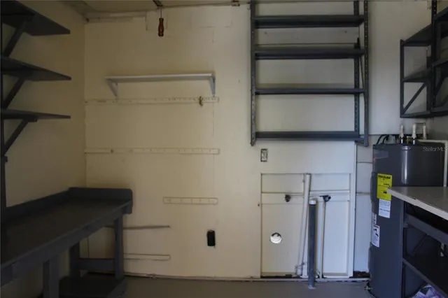 a view of storage and utility room with closet