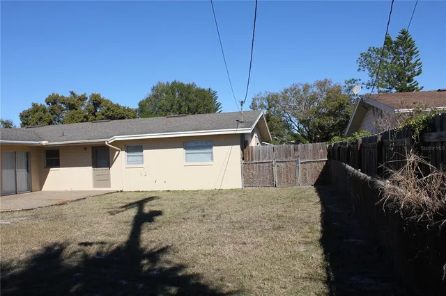 a backyard of a house with lots of green space