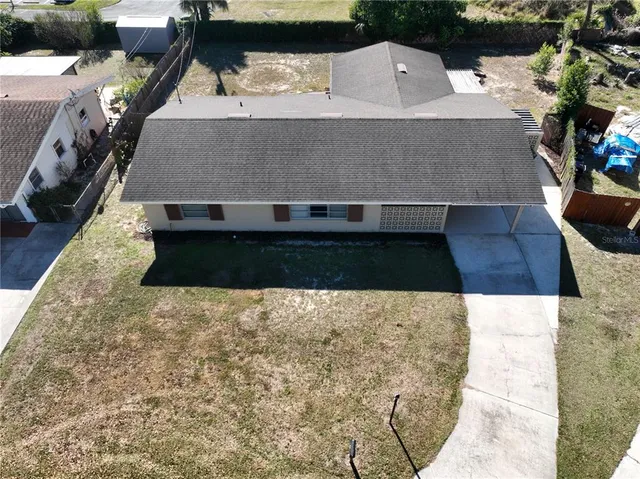 a aerial view of a house with a yard