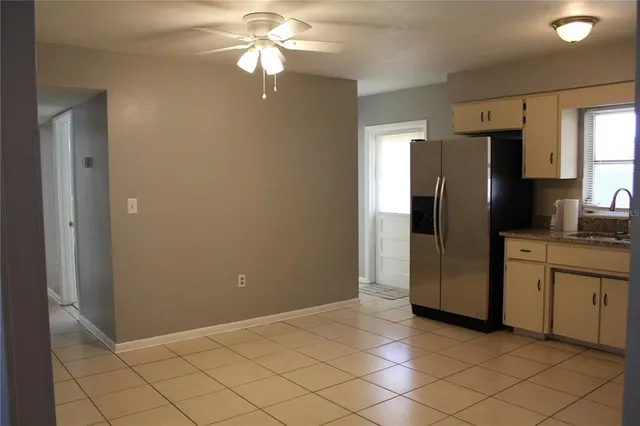 a kitchen with stainless steel appliances a refrigerator and a sink