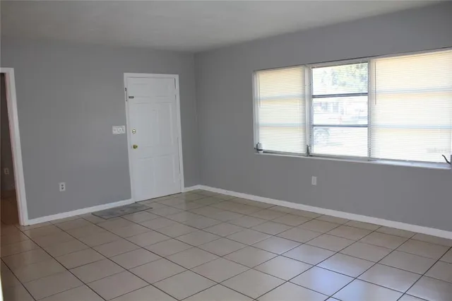 a view of an empty room with a window