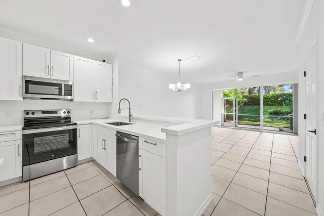 an empty room with white walls and tiles
