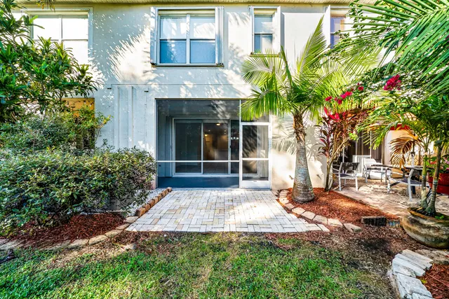 a view of a kitchen with marble wall and a chandelier