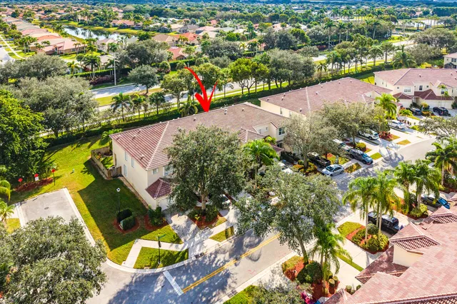 an aerial view of residential houses with outdoor space