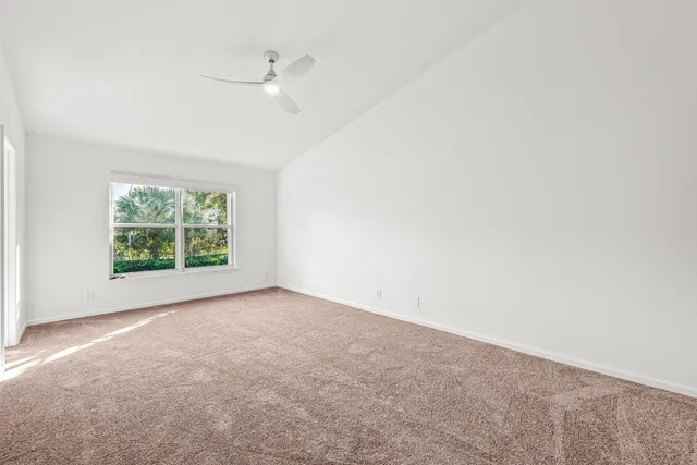 a view of a hallway with washer and dryer