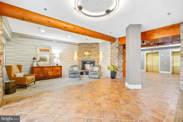 a gym room with large lots of furniture and a large window