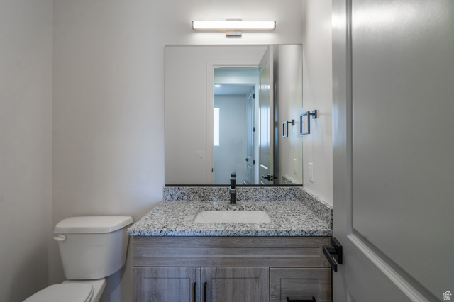 2972 West 570 North Hurricane, UT 84737 - Photo 18 of 104 Bathroom with toilet and vanity