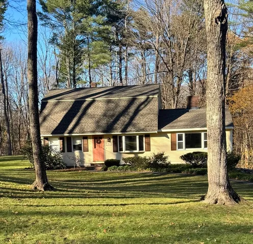 a big yard with lots of green space and trees