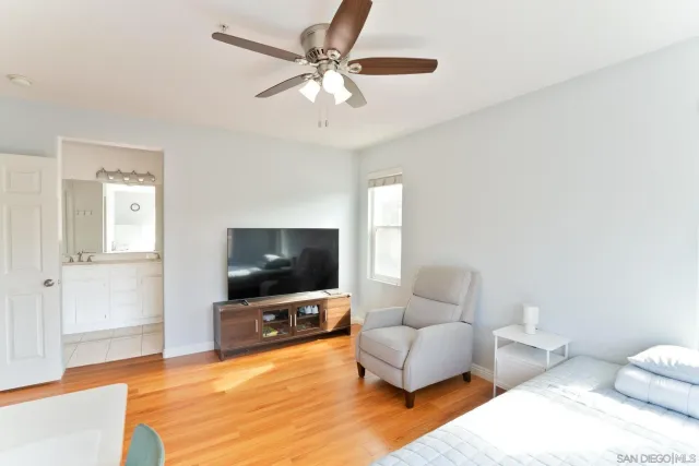 a bathroom with a sink a mirror and a shower