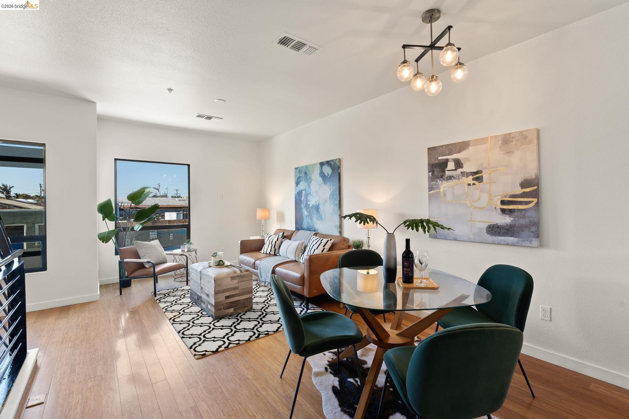 1780 12th Street Oakland, CA 94607 - Photo 10 of 31 a dining room with furniture a chandelier and wooden floor