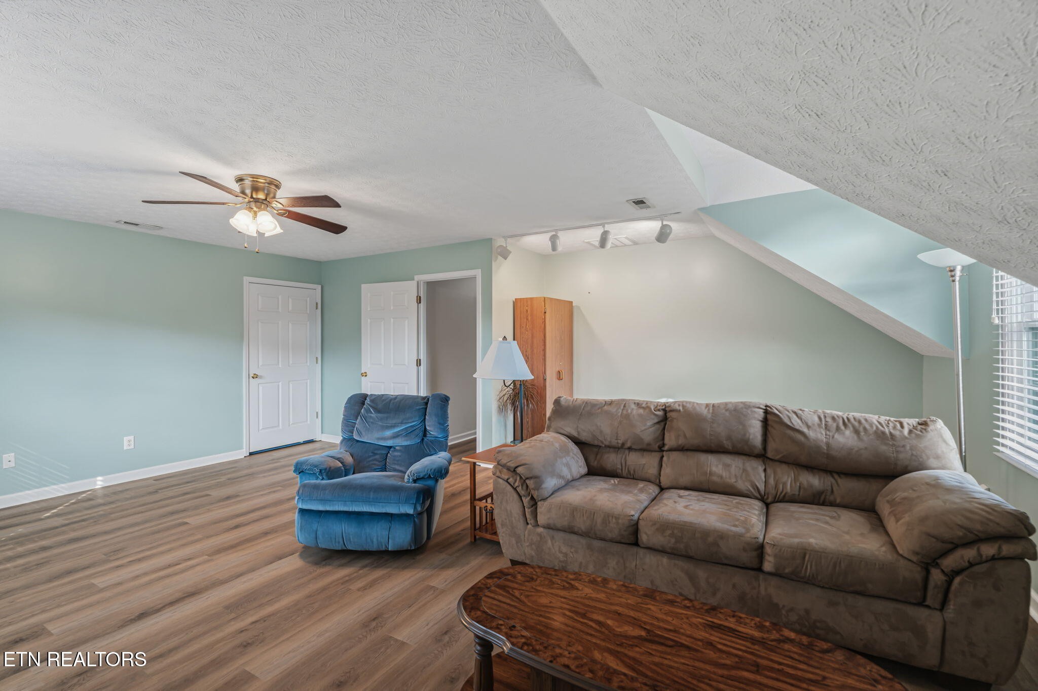 7030 Westerly Winds Road Knoxville, TN 37931 - Photo 33 of 40 a living room with furniture and wooden floor