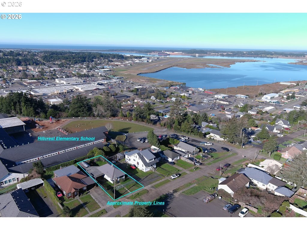 2260 Meade Avenue North Bend, OR 97459 - Photo 37 of 37 an aerial view of a city with lots of residential buildings ocean and mountain view in back