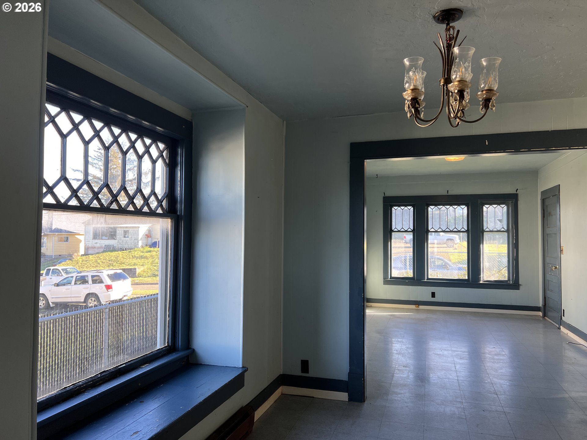 2260 Meade Avenue North Bend, OR 97459 - Photo 9 of 37 an empty room with wooden floor and windows