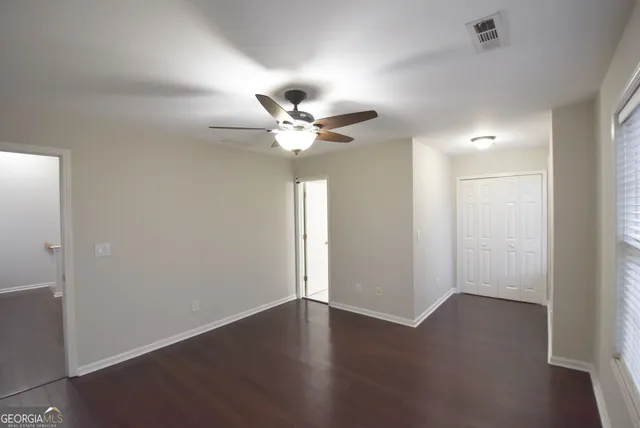 a white toilet sitting next to a bath tub