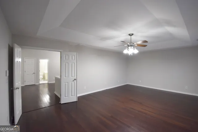 a view of a house with pool and sitting area