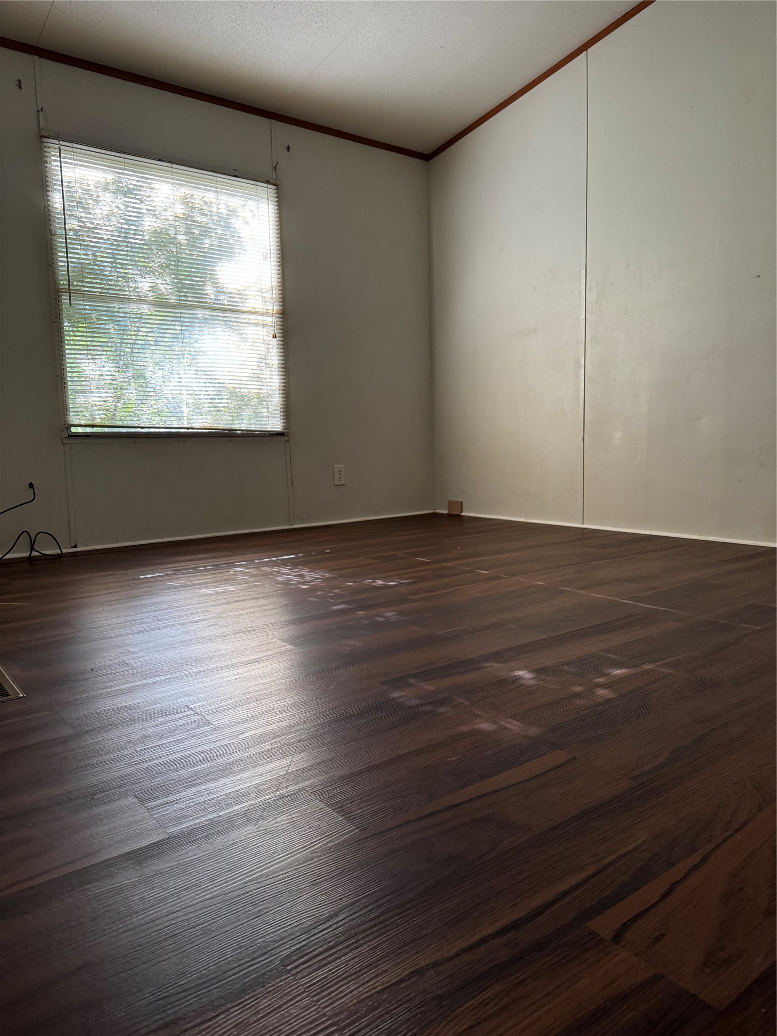 15930 Boss Gaston Road Sugar Land, TX 77498 - Photo 11 of 20 a view of an empty room with wooden floor and a window