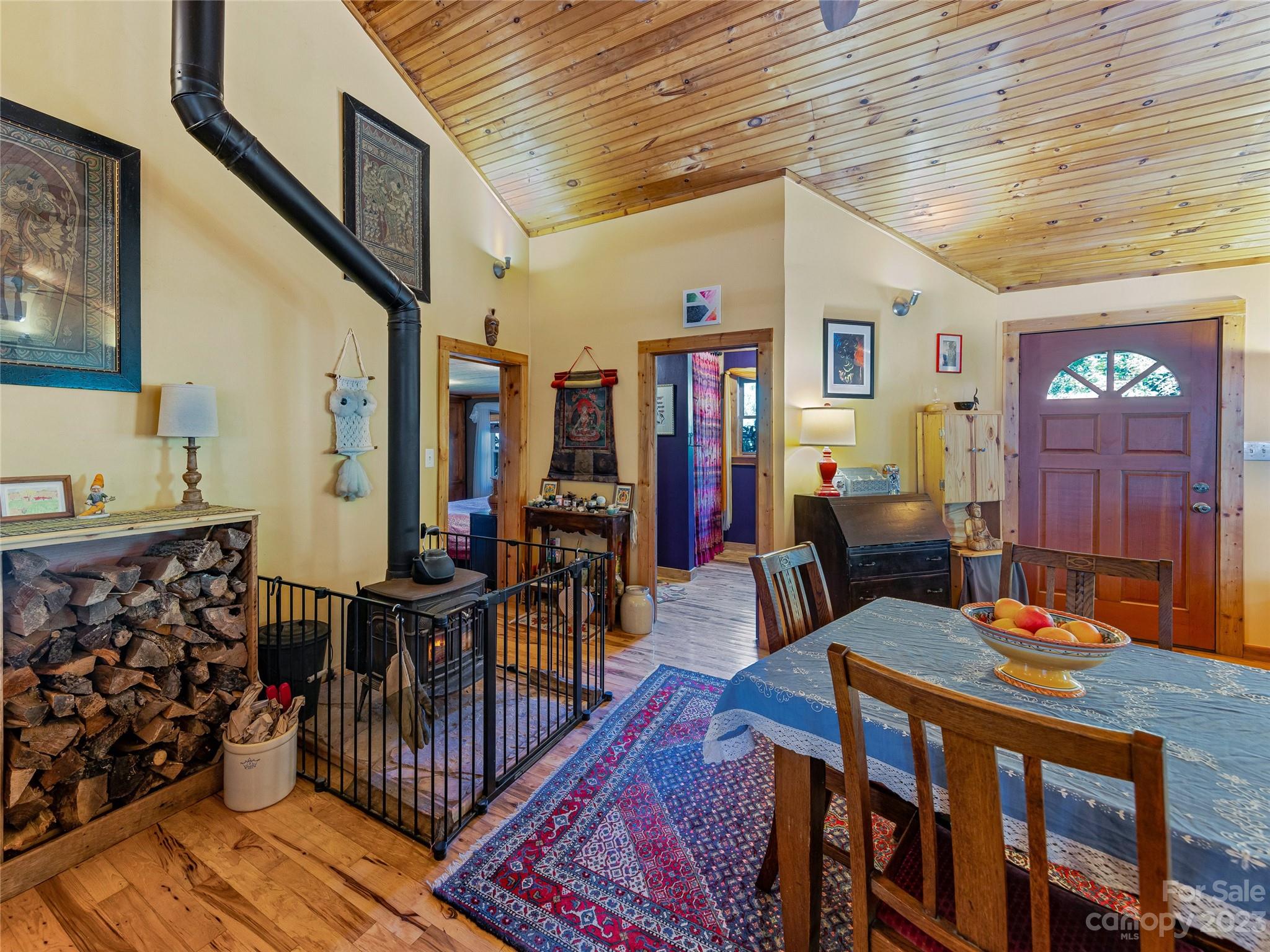 305 Pound Mill Road Marshall, NC 28753 - Photo 12 of 48 a dining room with wooden floor and furniture