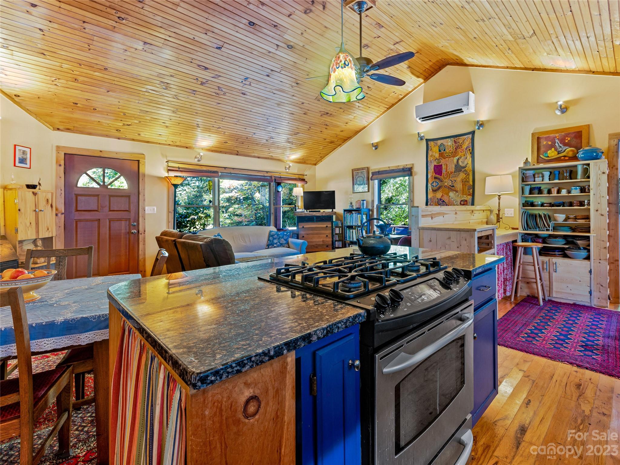 305 Pound Mill Road Marshall, NC 28753 - Photo 14 of 48 a kitchen with stainless steel appliances granite countertop a stove and a wooden floors