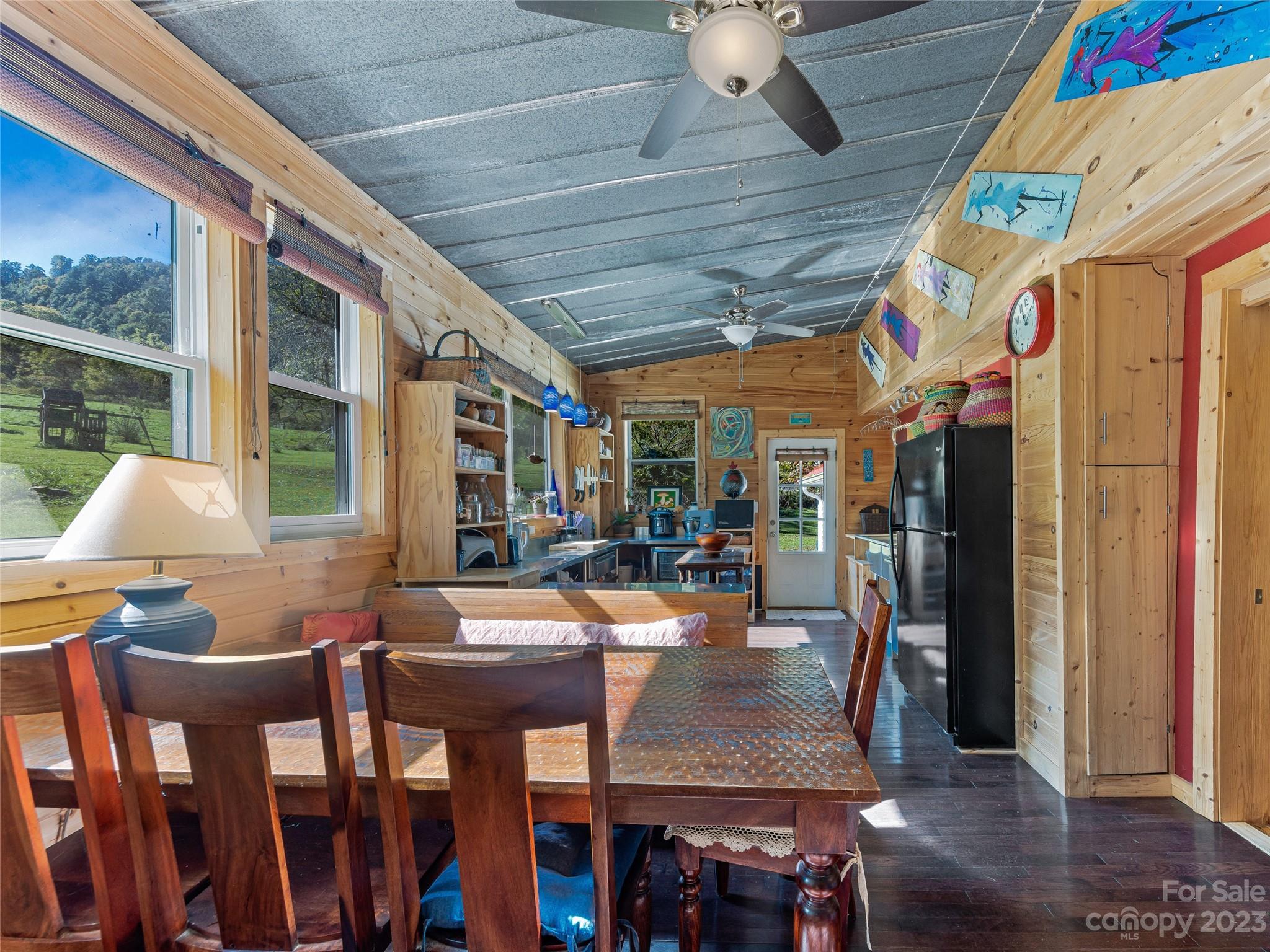 305 Pound Mill Road Marshall, NC 28753 - Photo 17 of 48 a outdoor space with lots of table and chairs