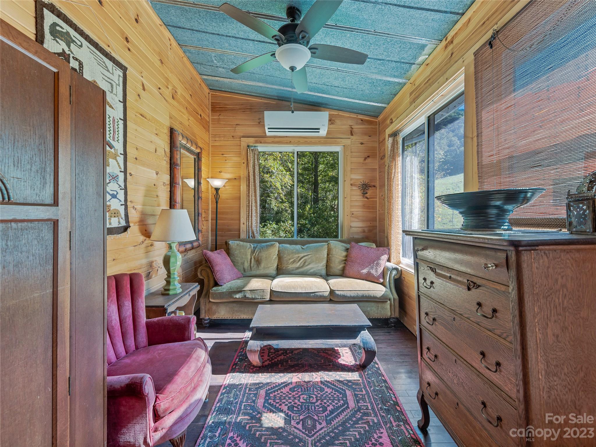 305 Pound Mill Road Marshall, NC 28753 - Photo 21 of 48 a living room with furniture and a large window