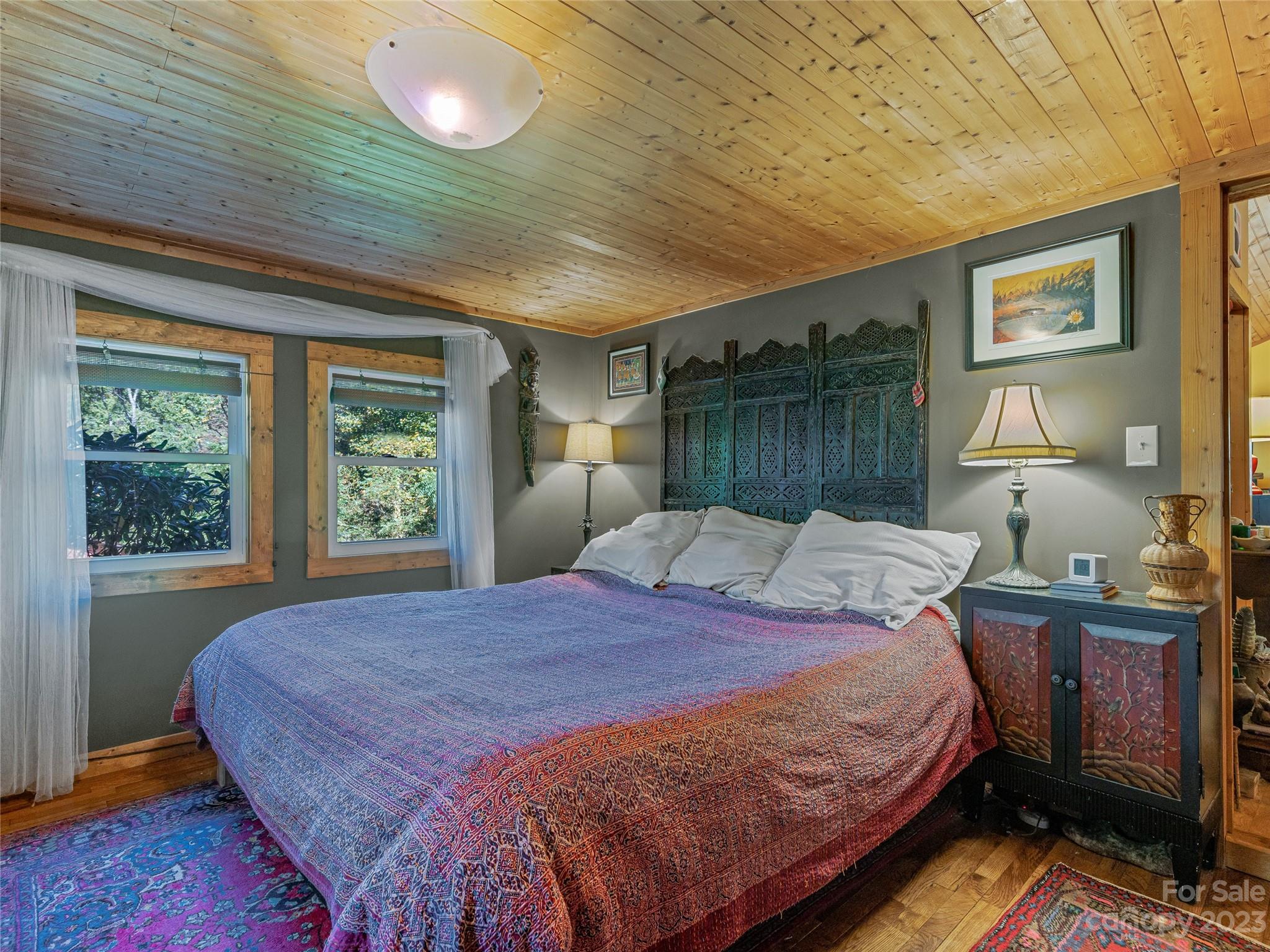 305 Pound Mill Road Marshall, NC 28753 - Photo 22 of 48 a bed sitting in a bedroom next to a window