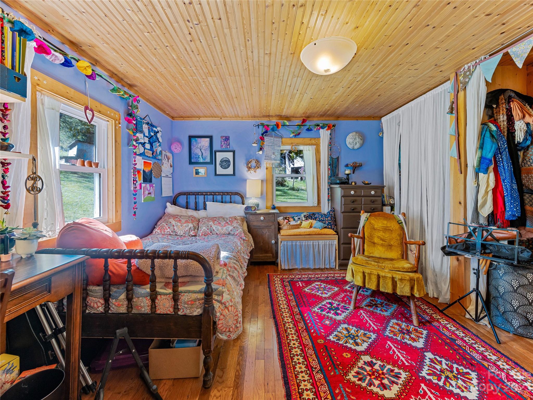 305 Pound Mill Road Marshall, NC 28753 - Photo 23 of 48 a bedroom with furniture and a window