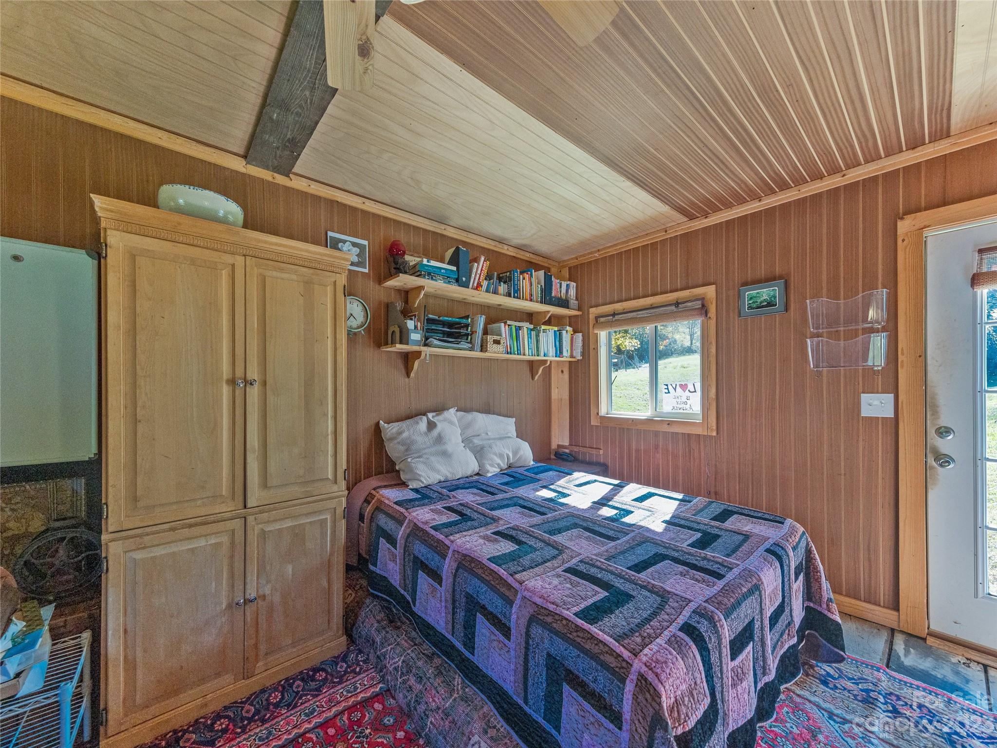 305 Pound Mill Road Marshall, NC 28753 - Photo 28 of 48 a bedroom with a bed and a dresser