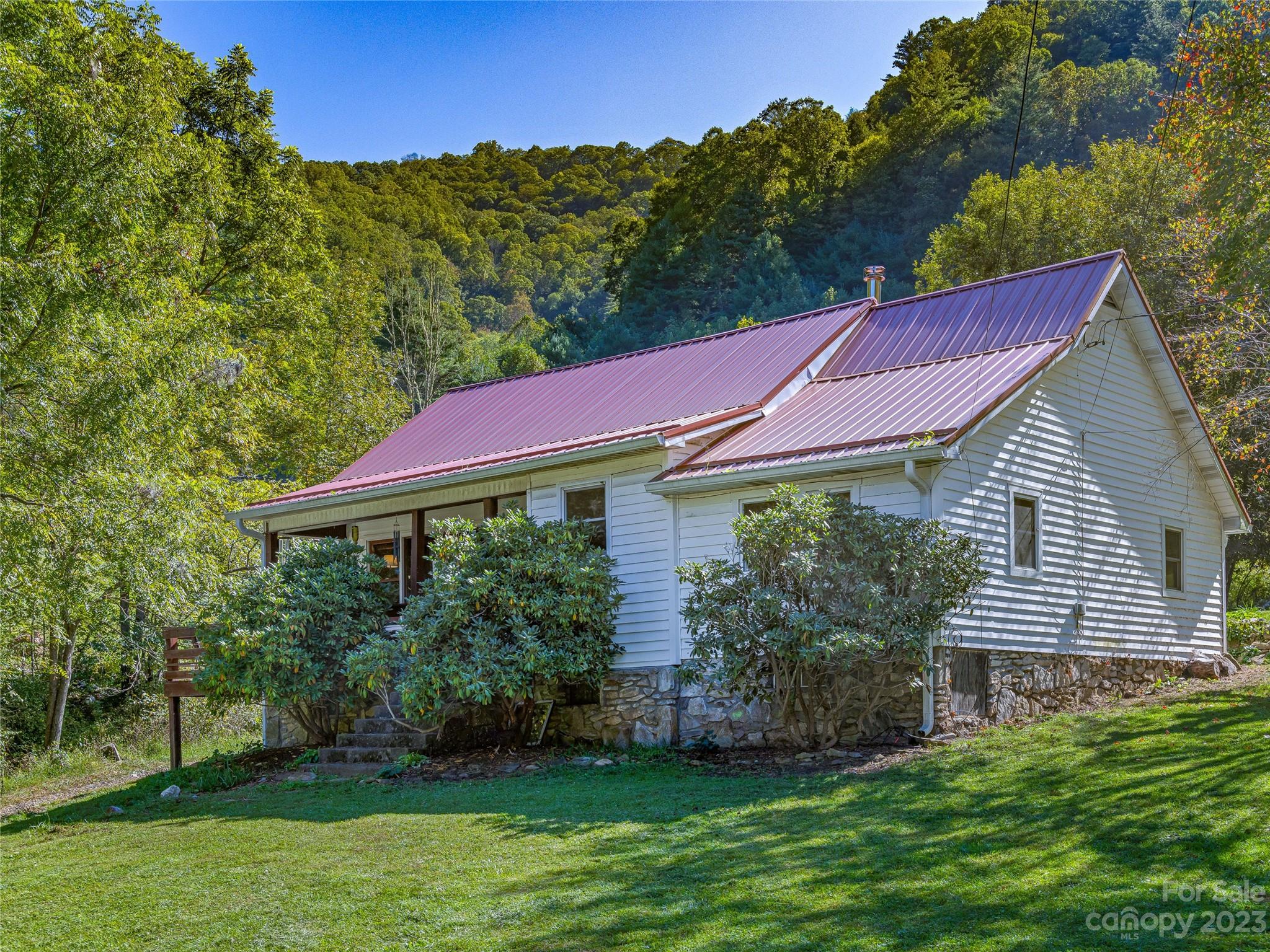 305 Pound Mill Road Marshall, NC 28753 - Photo 4 of 48 a view of a house with a yard
