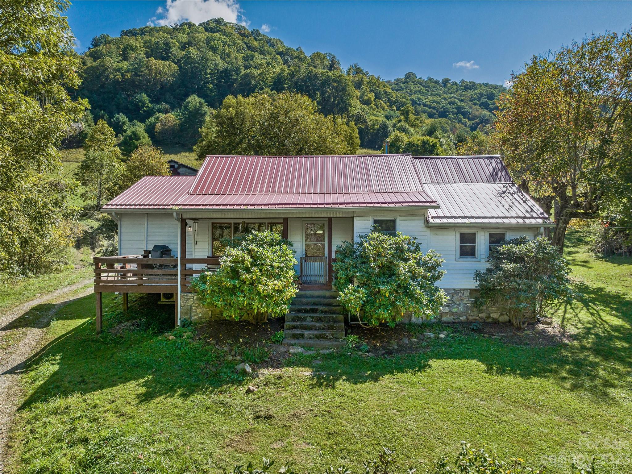 305 Pound Mill Road Marshall, NC 28753 - Photo 5 of 48 a front view of a house with garden
