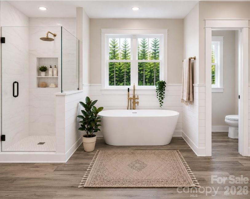9745 Flowes Store Road Midland, NC 28107 - Photo 14 of 20 a white tub sitting next to a shower